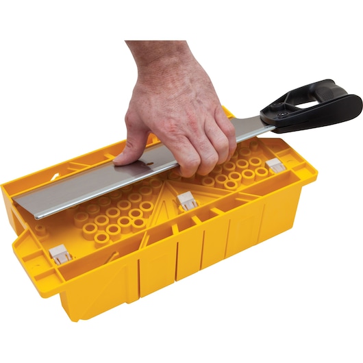 STANLEY 20-600 hand saw and yellow miter box in use, angled view on white background.
