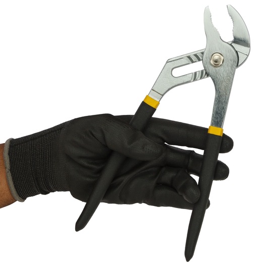 Photo of STANLEY 84-110-23 adjustable pliers held in a gloved hand, black and silver handles, side angle.