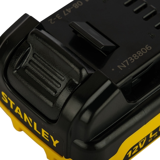 STANLEY SB12S 12V battery close-up, angled view, black and yellow casing, photography product