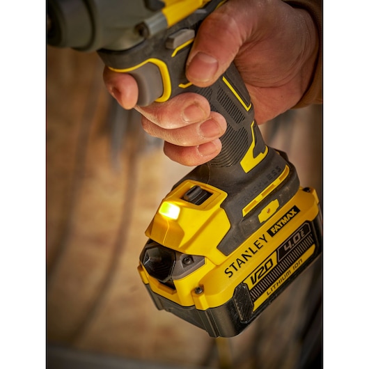 Photo of STANLEY SBW920 cordless drill with V20 4.0Ah battery and LED light, close-up in use.