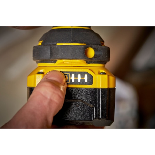 STANLEY SBW920 power tool close-up showing battery indicator and button being pressed.