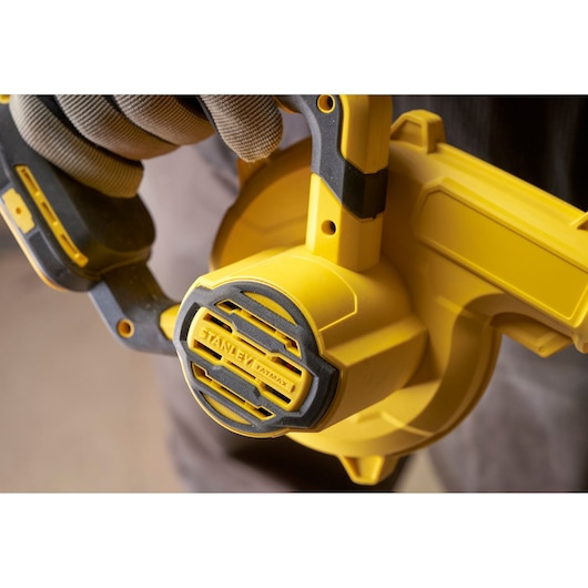 Close-up photo of STANLEY SCBL01 blower, showing yellow and black handle and fan cover.