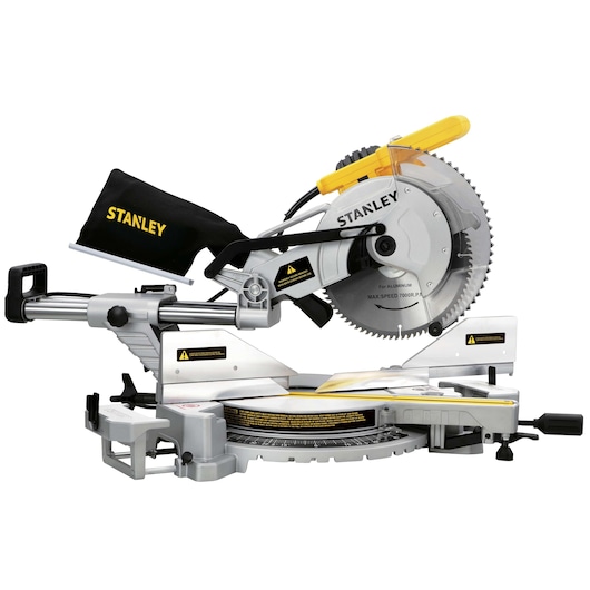 STANLEY SM18-B2C sliding compound miter saw with yellow handle, dust bag, and silver blade, side view on white.