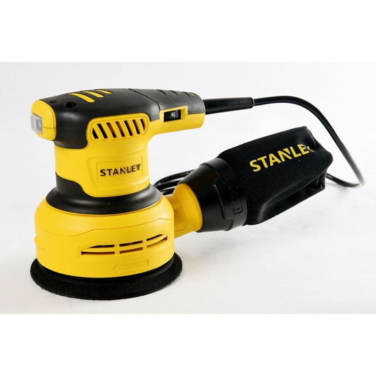 Stanley SS30-B2C yellow and black random orbital sander, side angle, with dust bag, on white background.