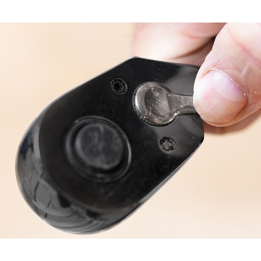 Close-up photo of hand adjusting direction switch on STANLEY STMT71662-LA black ratchet handle.